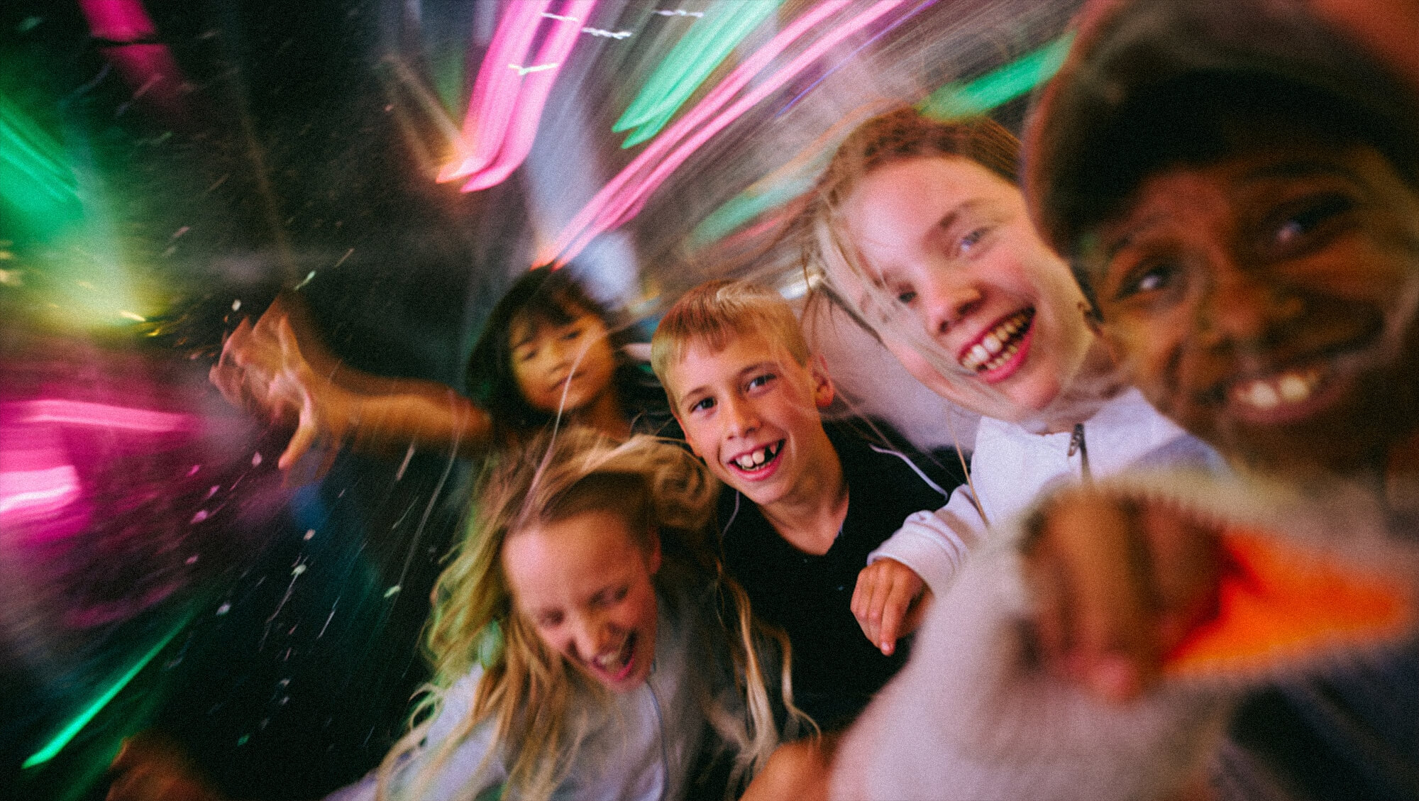 Friends supporting each other while roller skating in Sydney at SKTNG community rink.